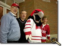 Charlie Ebersole with his dad and grandfather at a Miami hockey game photo