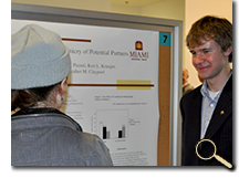 Charlie Ebersole discussing research results at poster session photo