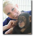 student researcher embracing primate photo