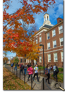 Students walking in front of Upham Hall in October photo