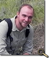 Tim Webster in field w/ Triceratops fossil photo