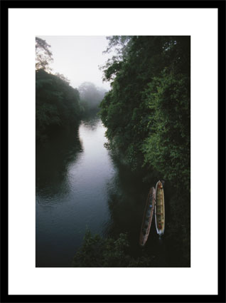 Two long canoes on a river running through the Costa Rican rainforest - Click Image To Buy this Framed Art Print at AllPosters.com